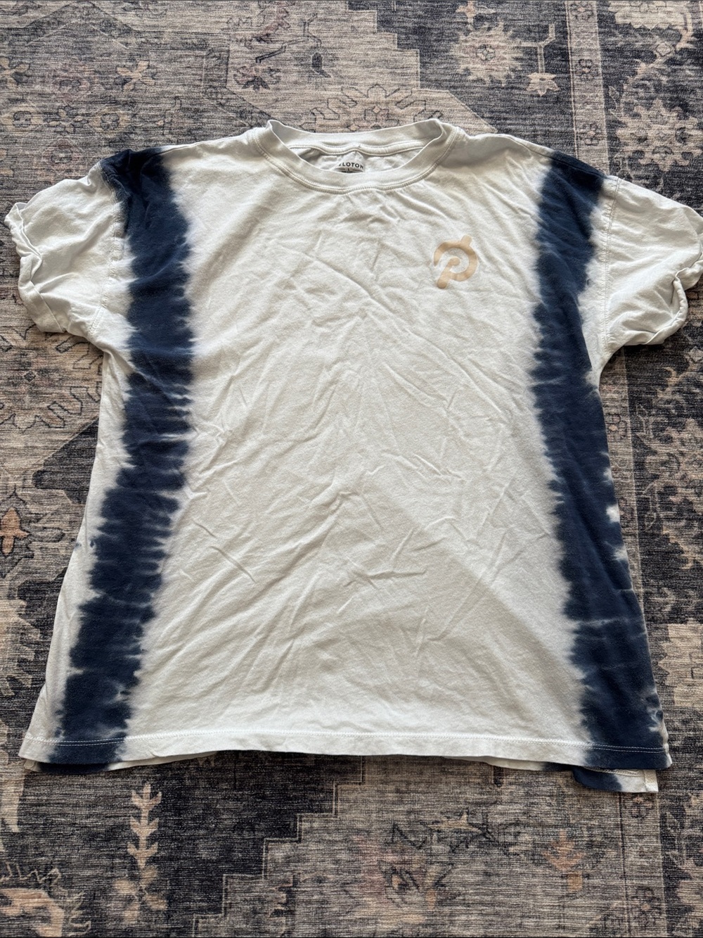 Peloton White Tee with Navy Tie-Dye Side Stripes and Gold Logo